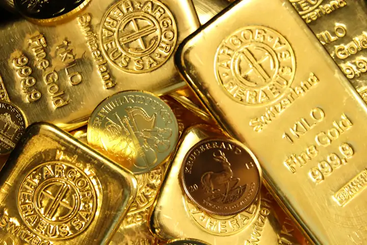 Gold bars and coins stamped with purity marks